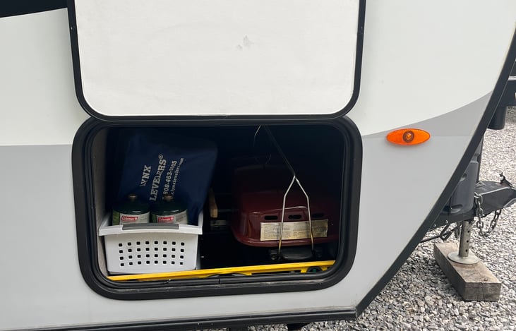 Underneath storage. Propane and grill provided.