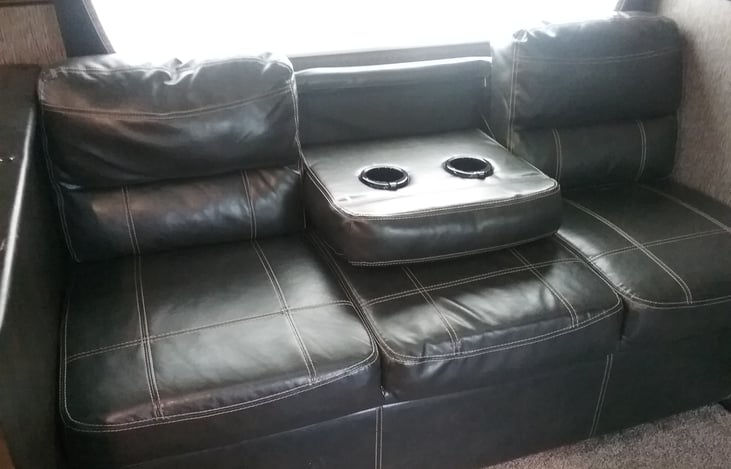 2 USB charging ports by cup holders.