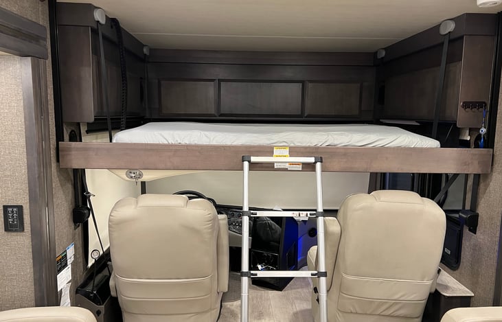 Over Drivers pilot seat power retractable queen size bed.