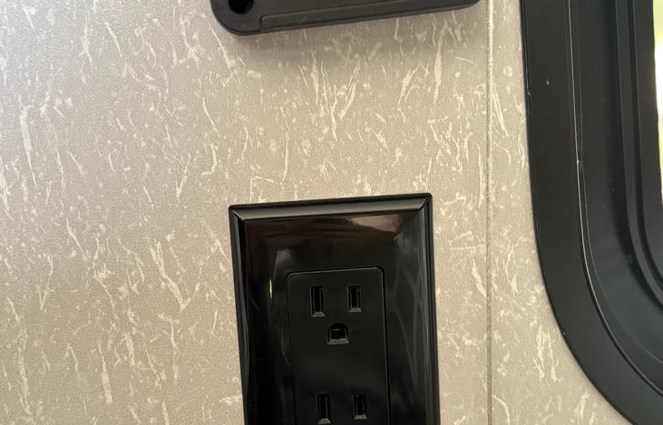 Electrical and USB outlets near Queen bed