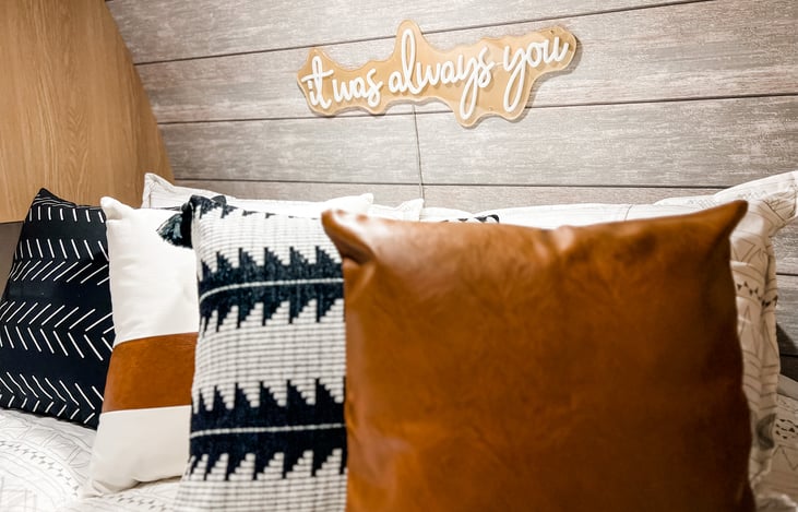 Master bedroom with LED sign "It was always you"