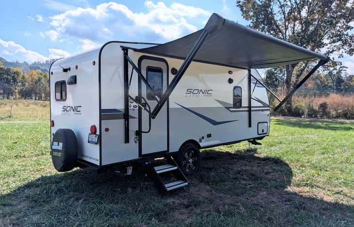 Easy-tow 2022 Venture Sonic Lite (3,600 lbs)! Features off-grid solar, all-terrain tires, slide-out, spacious rear kitchen, queen bed & power awning. Perfect couple's getaway for any adventure!