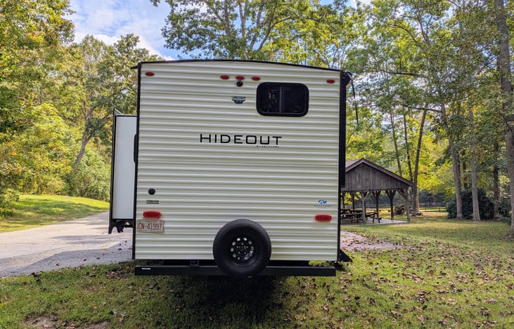 This spacious 2021 Keystone Hideout 250BH sleeps 8 with a bunkhouse  layout, outdoor kitchen, and upscale interior. Features include: electric fireplace, central vacuum, outdoor kitchen, and more.