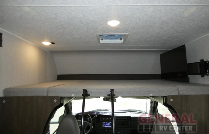 Interior: Living Area, Facing toward the cab and overhead deb