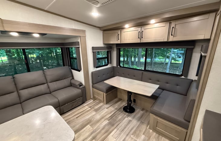 Large dinette accommodates 5-6 people. Converts into an extra bed.