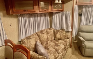 A 5th wheel travel trailer suited for 2 people