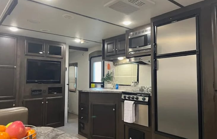 Good size fridge and tv viewing from kitchen, living and bunks.