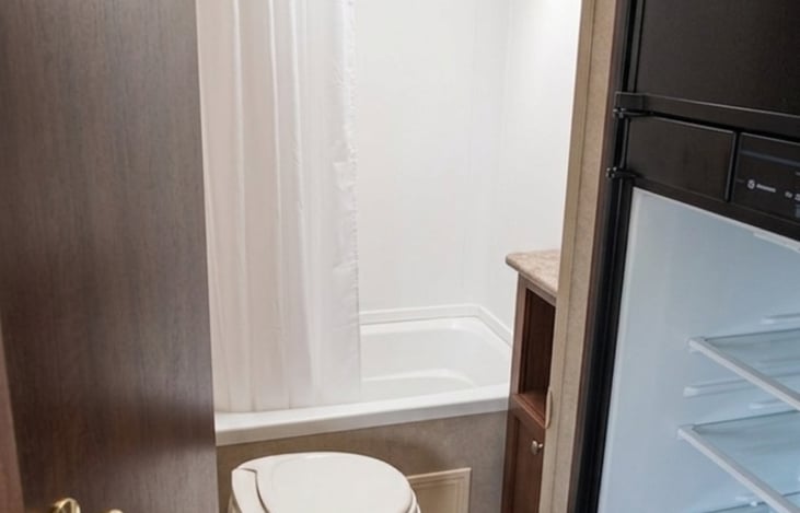 Roomy shower with a bathroom vanity.