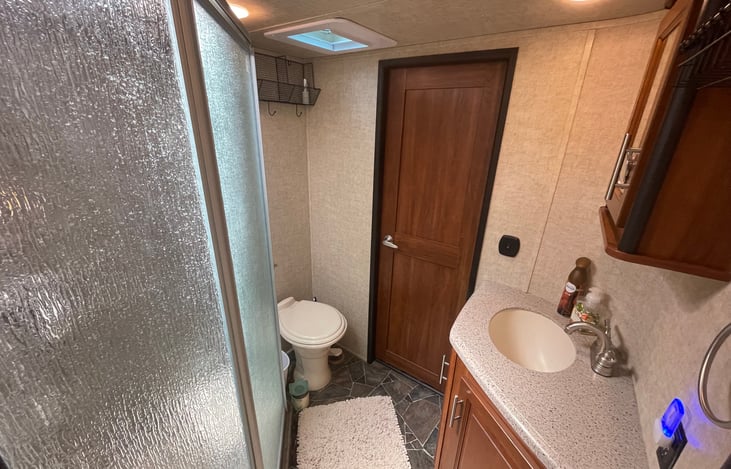 Bathroom, w/door to living room.