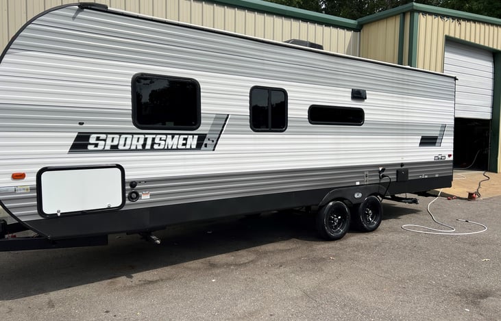 The tinted windows offer privacy. Plus keep the camper nice and cool in the summer time weather. This unit also has a outside shower.