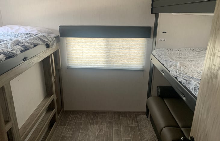 2 twin bunks with full size jack knife sofa