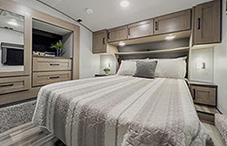 The main bath room boost plenty of space to sleep and store. It has its own A/C.