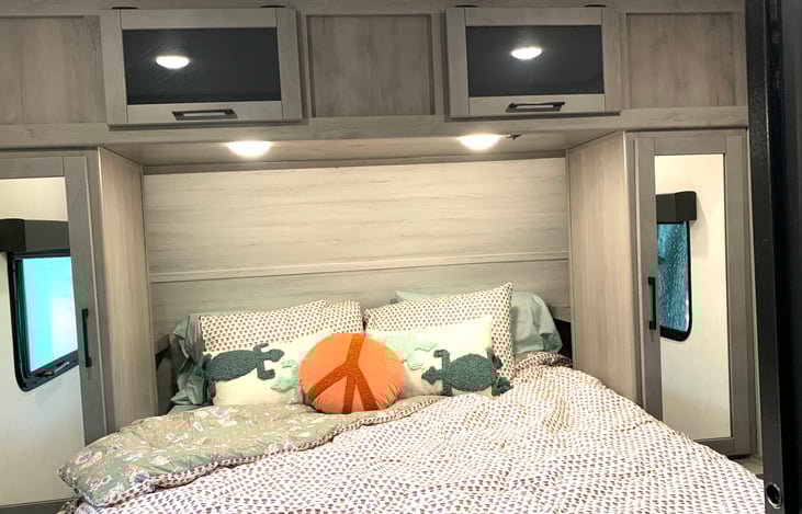 Queen Size Tempur-Pedic Foam mattress for a restful sleep! Sliding door shuts off the room completely. Smart Tv (not shown) is ready to stream for nighttime downtime.