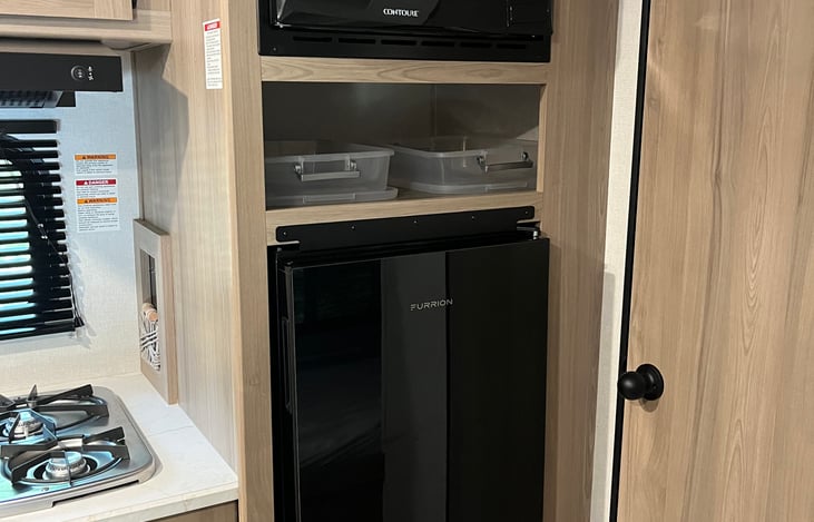 Small pantry with plastic boxes