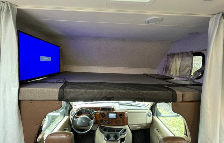 Over cab bunk is nearly a king size bed