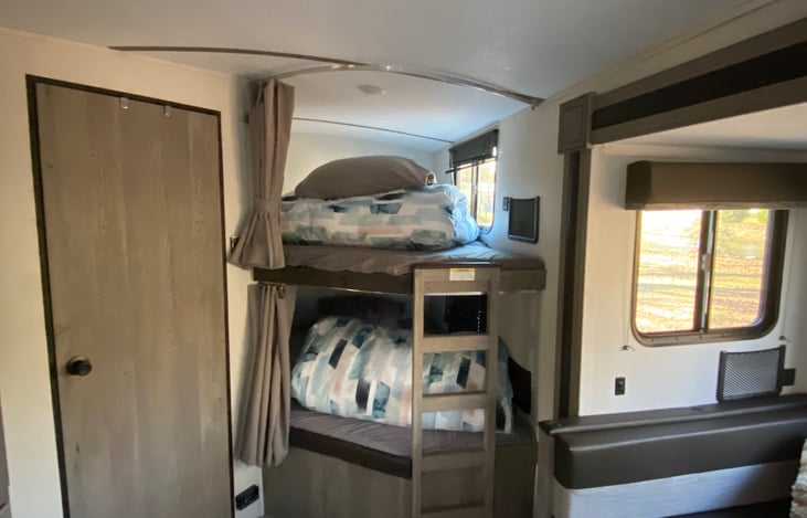 Two bunks could sleep two each. Each had privacy curtains and usb plugs.