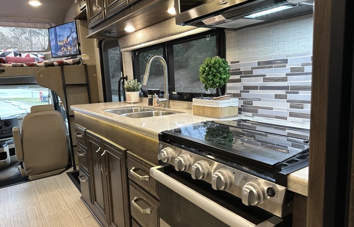 Stove features a three burner cooktop as well as full oven