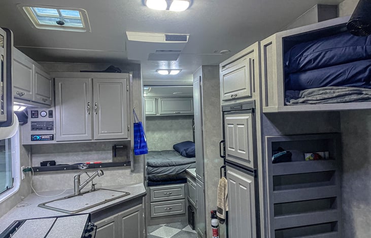 Front queen memory foam mattress. Full size fridge. Extra pillows and blankets