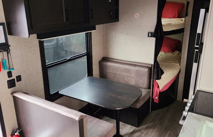 Dinette that seats 4 and can be converted to a comfortable bed.