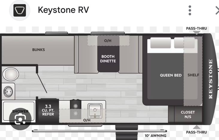 Slide out had dinning tablet, two bunks in back and full kitchen. Master bedroom is in front.