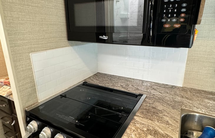 Microwave and 3 burner stove.