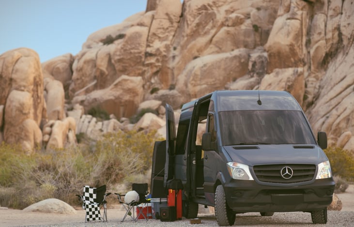 Two foldable camping chairs are included, ideal for sitting back and enjoying the surrounding outdoor scenery.