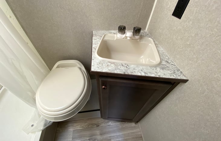 Bathroom sink, dual outlet and toilet
