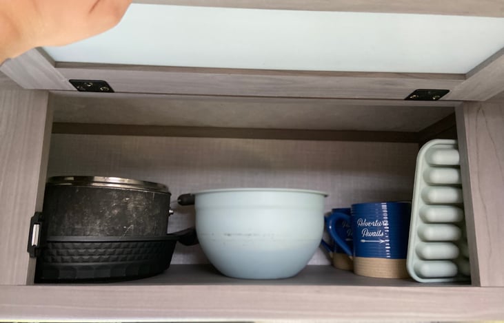 Three bowls, two pans, four mugs, one ice tray