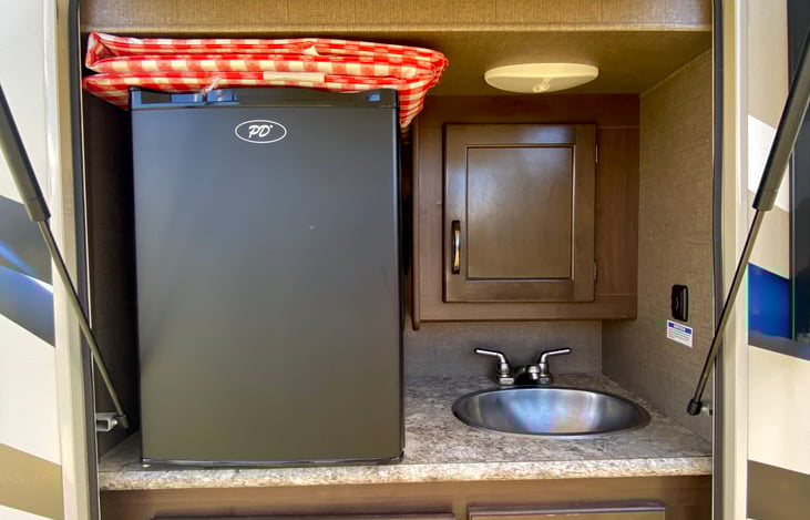 outside refrigerator and sink for true outdoor living!