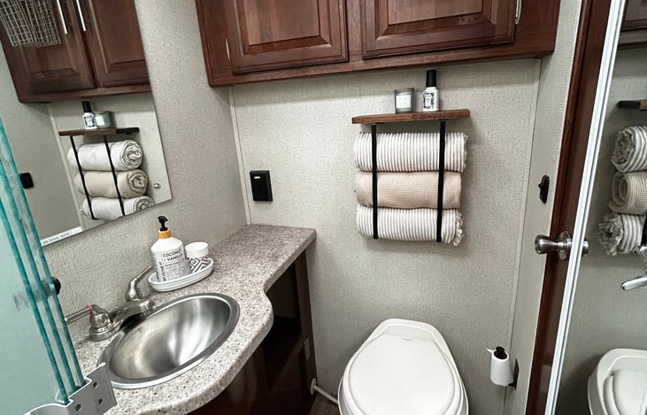 Includes toilet paper, hand towels, hand soap, shampoo, conditioner, body wash, toothpaste, toothbrushes, washcloths, towels, and full length mirror. First aid items such as mosquito repellent.