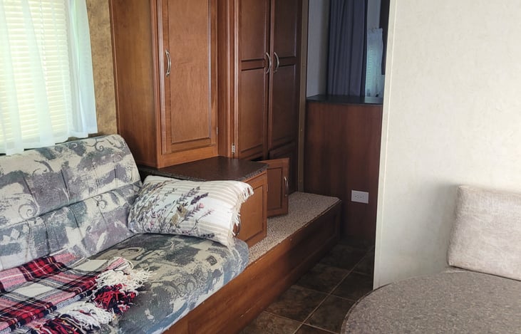 Large closet at the end of the couch.