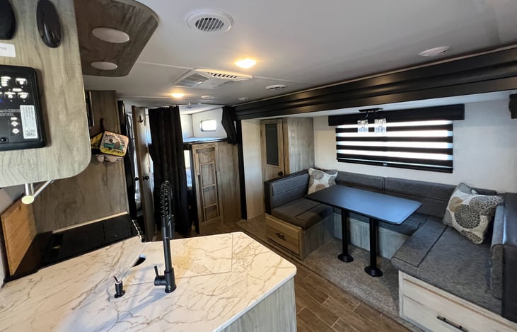 1 large slide-out for the dinette and pantry. With huge storage under the dinette seats!