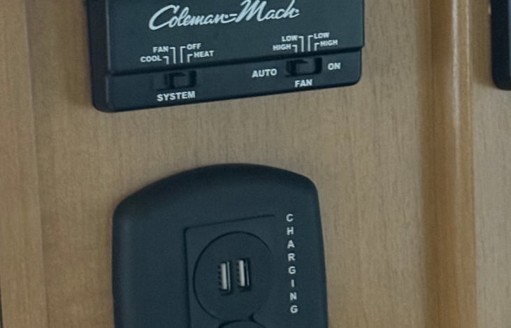 RV has LP furnace & 120v air conditioning that can be run from generator or shore power.