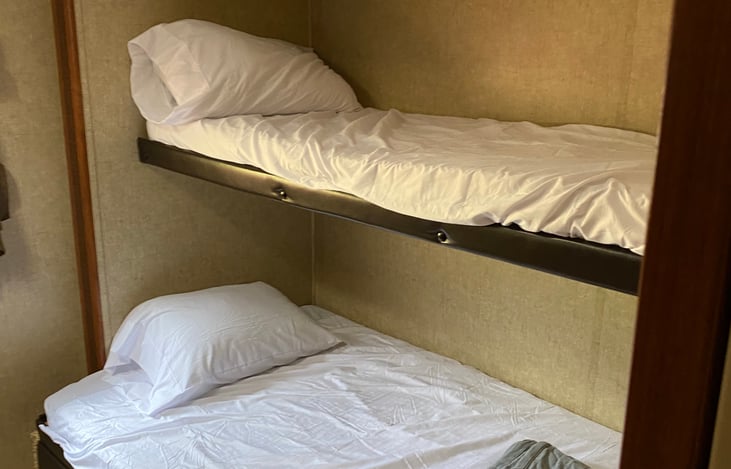 One twin up top full in middle and pull out trundle bed