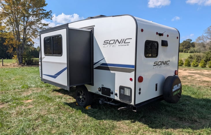 Easy-tow 2022 Venture Sonic Lite (3,600 lbs)! Features off-grid solar, all-terrain tires, slide-out, spacious rear kitchen, queen bed & power awning. Perfect couple's getaway for any adventure!