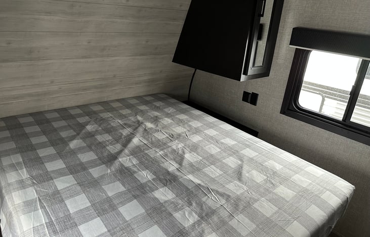 Queen sized bed in master