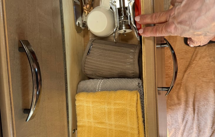 kitchen towels, measuring cups, wine openers, oven pad