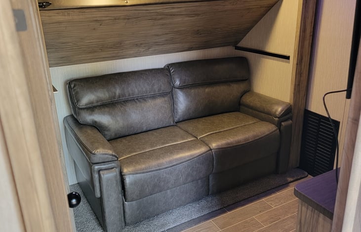 Second Bedroom Couch with bunk in the storage position. Couch turns into pull out bed