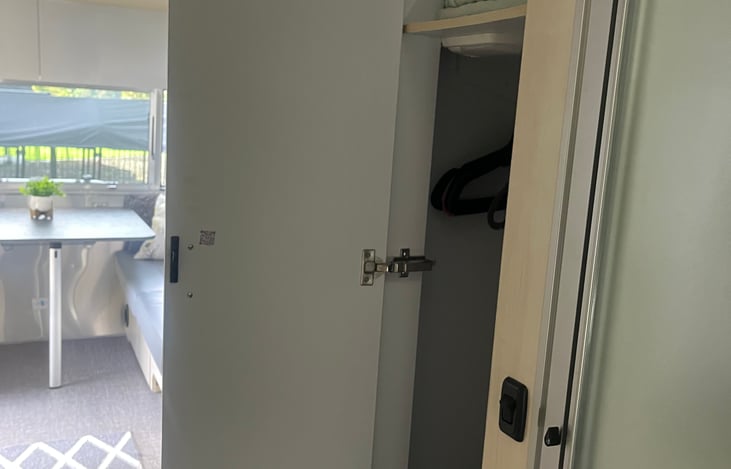 Closet in hall next to the shower