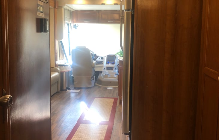 Galley way with lots of room to move between bedroom area or bunks to bathroom. Spacious living area.