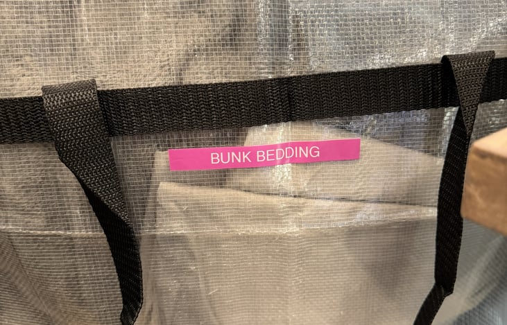 Extra bedding is secured in bags for cleanliness and ease of storage