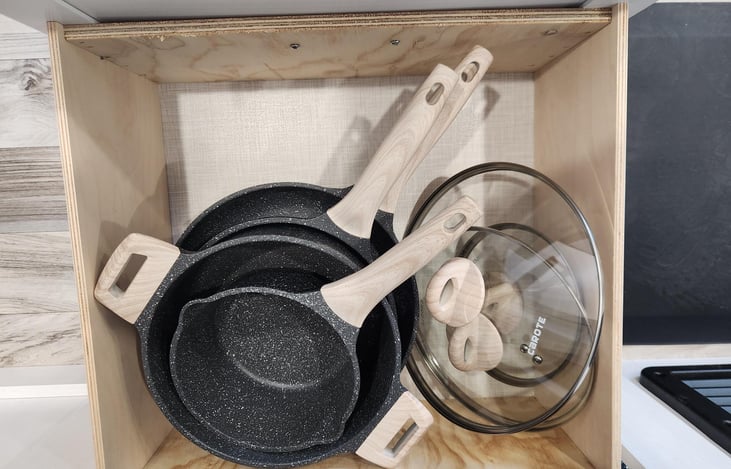 pot and pans drawer under fridge