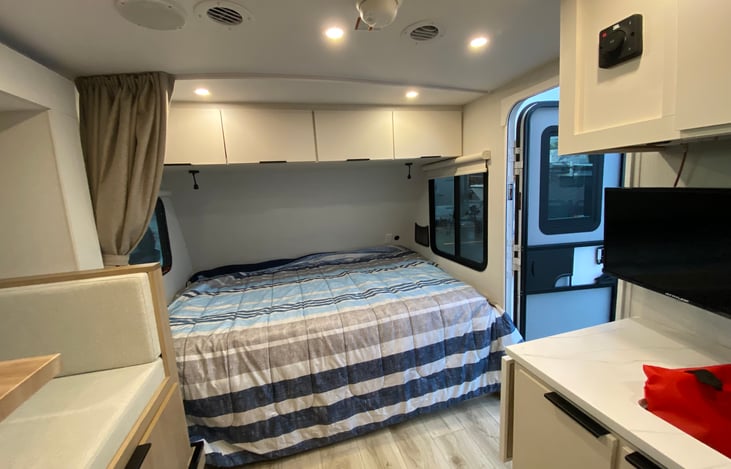 Queen-size bed with plenty of storage above or below!