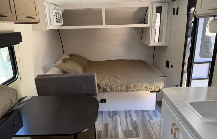 Queen sized bed and additional storage space.