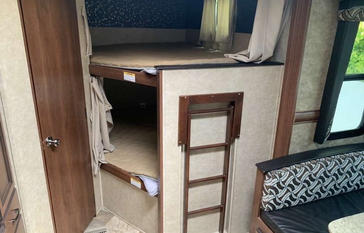 Bunk beds that are double over double and can sleep 2 people each.  The bunk ladder folds in when not in use.