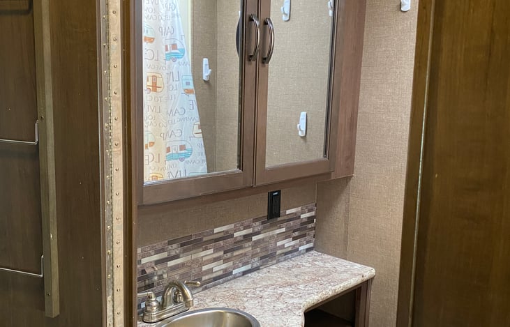 Bath with storage for toiletries