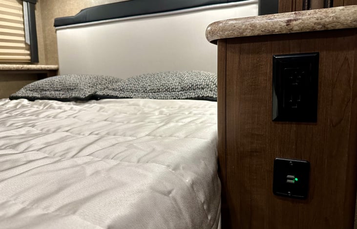 Queen Bed has Outlet, USB Port, and Auxiliary Power Outlet