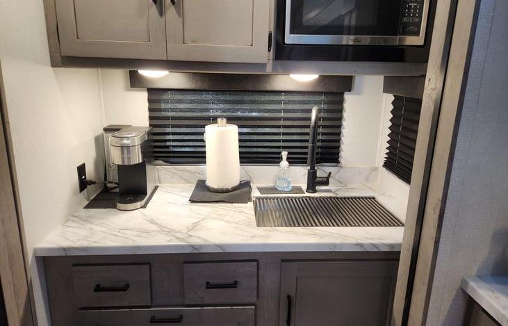 KEURIG Coffee maker on the left and microwave above sink!