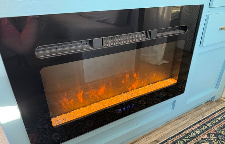 Electric fireplace to keep you warm at night, with. Wonderful glow to feel nice and cozy.  (Can also change the color for a different vibe)