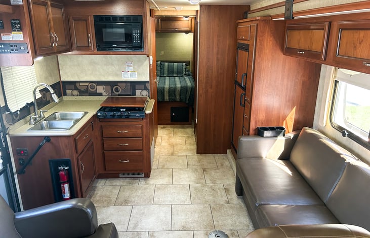 Interior - note the couch that pulls out into a bed.  It also has a table hiddn beneath it that can set up in about two minutes.